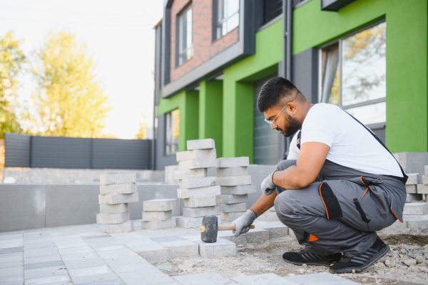 Indian worker lay paving tiles, construction of brick pavement, men's hands in gloves SSUCv3H4sIAAAAAAAACoRSy27bMBC8F+g/GDxHqERKlNRjeypQoB8Q9LB82CZMkQYfCYLA/x6SklK6aNAbd2YfnJ19/fzpcEAMvOLo6+E1RylWWkcfHARlTYLbhw130gjpauTJEdrWAKg6kkIF6xToGmQQ+NnAIhNootYZvhUS+QAheumrvwgnYfFBlXRS5XII8pSa32XvSh7X+LAThUwViUI/jMjq8q8eKtZHltnv1iQy8qJ9p9eRH/T7FpUWypz8l59gxALu4v/V+FcMwlr3p+f6+P2+uZM0/CVruVUqndQS1o1smhDmsu0wFQ3tGWt6ll6TnGhDJkLngdK2m6cyZW2NLs9BuqVsaWsKUShbbe3JctD+r/2CuoKDu7qrUzwJrRAbzuUg9k7cRhNcVoH2HSBt7RWYzv4d0xi542fwPqWLHa+9TQbZpZpjbCg72LoikczPYUfImEUPeBiHlg5ttyWsl3RWqU/5zv7BeNUWhMxD3628v7FuJLin0zzOK797n31cVAj/rZ3w0PVb7d1tW35R4sPbRqSndOzaqSvmbVUqT0MSjqLHMDUgeLKcj7xh44gbMkiJGQhM5mOqur0BAAD//wMAX81Fes8DAAA=
